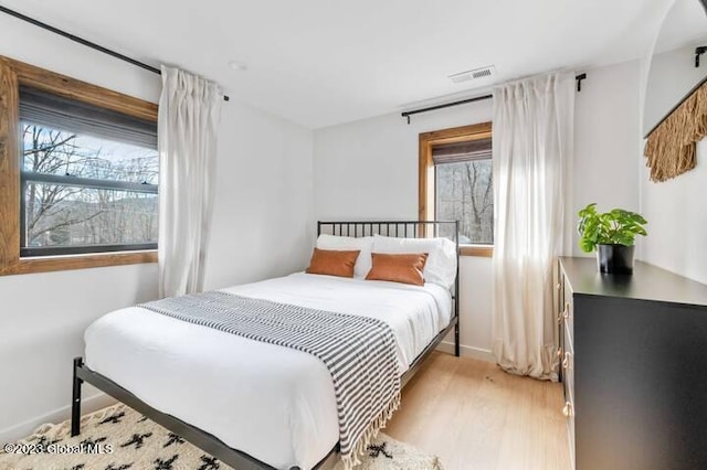 bedroom featuring light hardwood / wood-style flooring