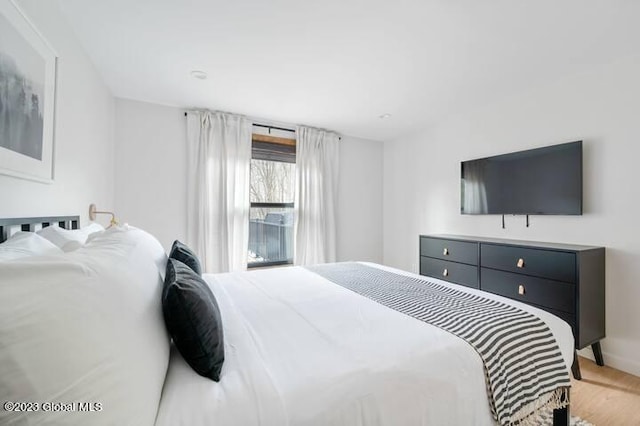 bedroom with light wood-type flooring