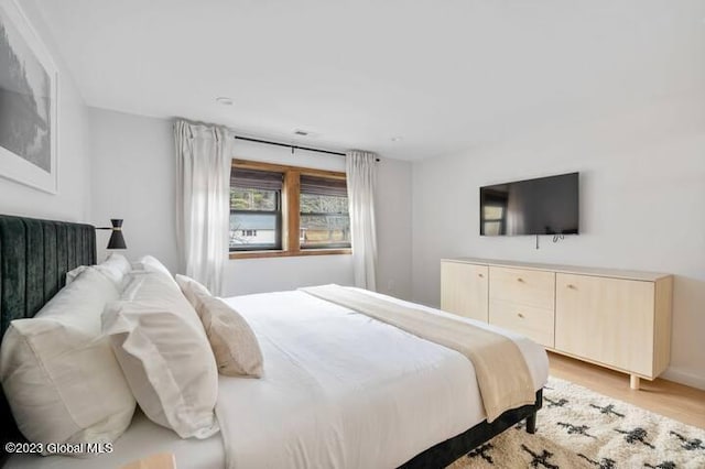 bedroom with light wood-type flooring