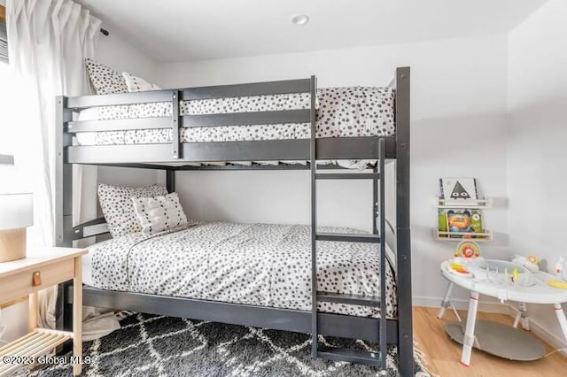 bedroom with hardwood / wood-style floors