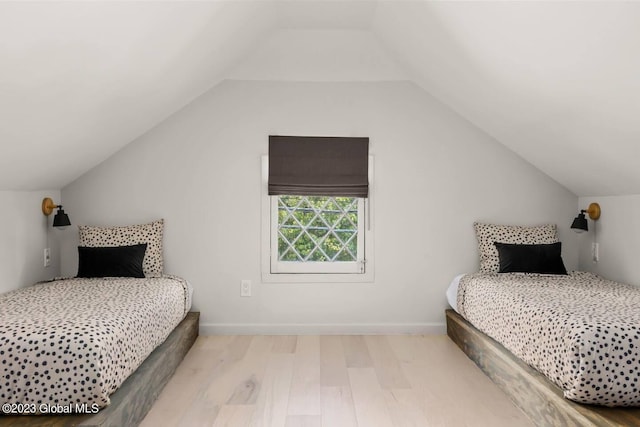 7913 Main St, Hunter, NY 12442 - bedroom with light hardwood / wood-style floors and lofted ceiling