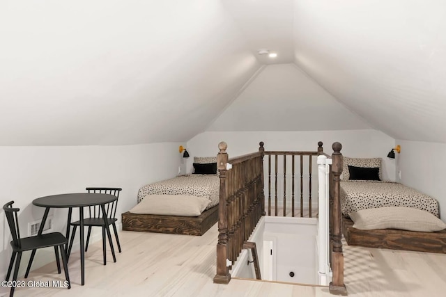 7913 Main St, Hunter, NY 12442 - bedroom with lofted ceiling and light hardwood / wood-style flooring