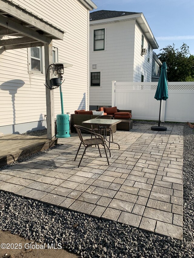 view of patio / terrace with fence and an outdoor hangout area