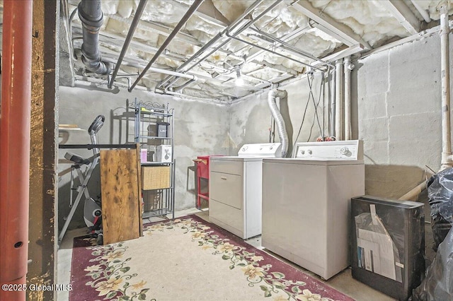 unfinished basement featuring washing machine and dryer