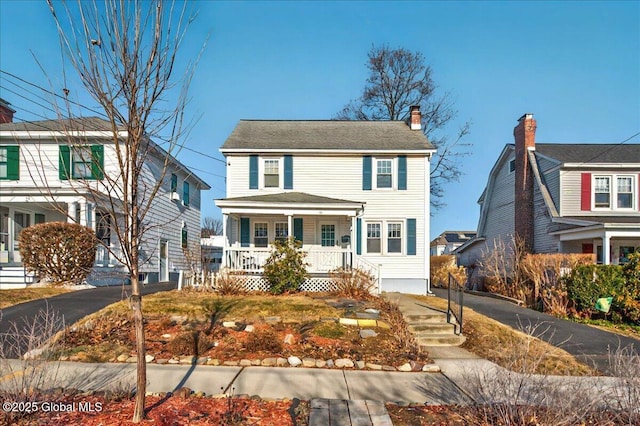 view of front of home featuring a porch and driveway