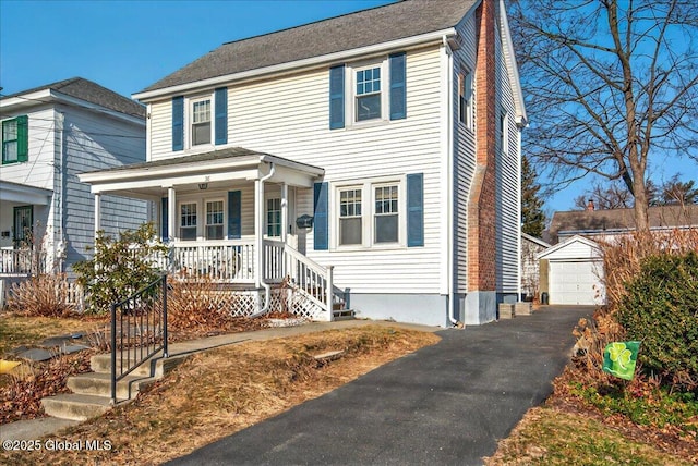 view of front facade featuring a garage, covered porch, an outdoor structure, and a chimney