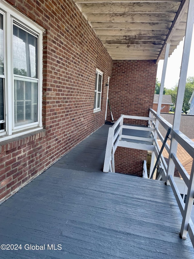 wooden terrace with a porch