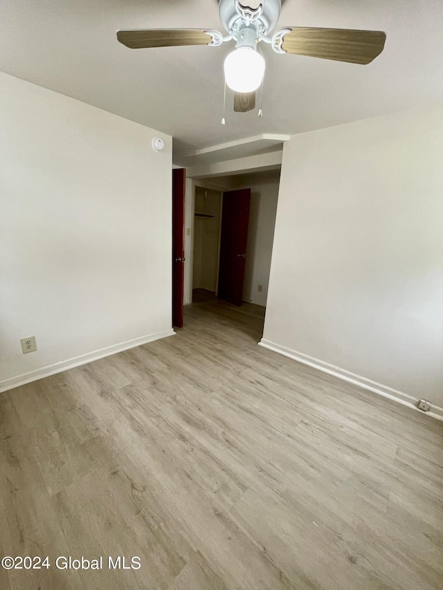 unfurnished room featuring ceiling fan and light hardwood / wood-style flooring