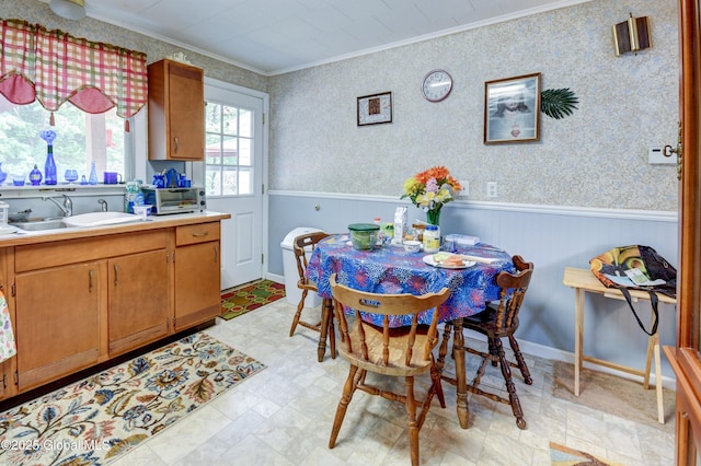 292 N Main St, Northville, NY 12134 - dining room with crown molding, a wainscoted wall, and light floors