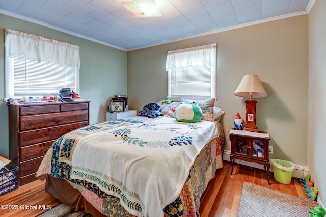 292 N Main St, Northville, NY 12134 - bedroom featuring ornamental molding, hardwood / wood-style flooring, and baseboard heating
