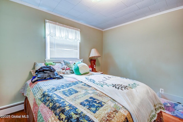 292 N Main St, Northville, NY 12134 - bedroom with baseboard heating, ornamental molding, wood finished floors, and baseboards