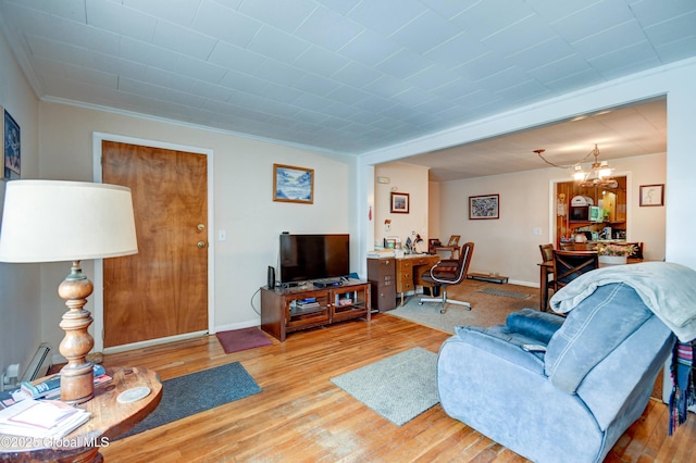292 N Main St, Northville, NY 12134 - living room featuring ornamental molding, an office area, wood finished floors, and baseboards