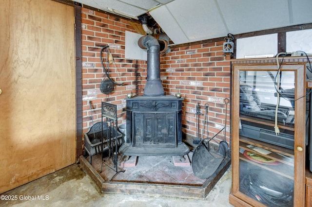 292 N Main St, Northville, NY 12134 - detailed view of a wood stove and unfinished concrete flooring