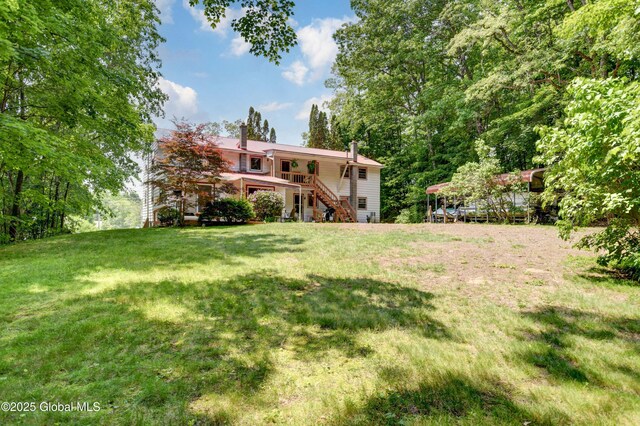 292 N Main St, Northville, NY 12134 - view of grassy yard with stairway and a deck