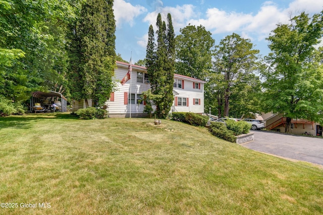 292 N Main St, Northville, NY 12134 - view of front facade with a detached carport and a front lawn