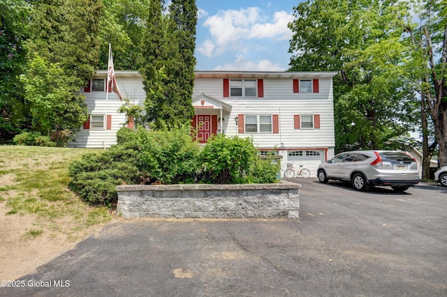 292 N Main St, Northville, NY 12134 - view of front facade featuring a garage and asphalt driveway