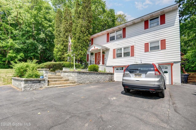 292 N Main St, Northville, NY 12134 - view of front of house with driveway and an attached garage