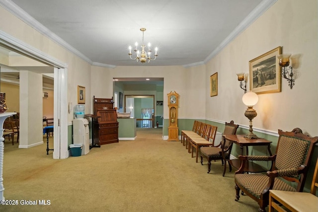 sitting room with ornamental molding, light carpet, and an inviting chandelier