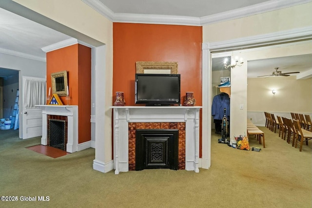 living room with carpet flooring, ceiling fan, and ornamental molding