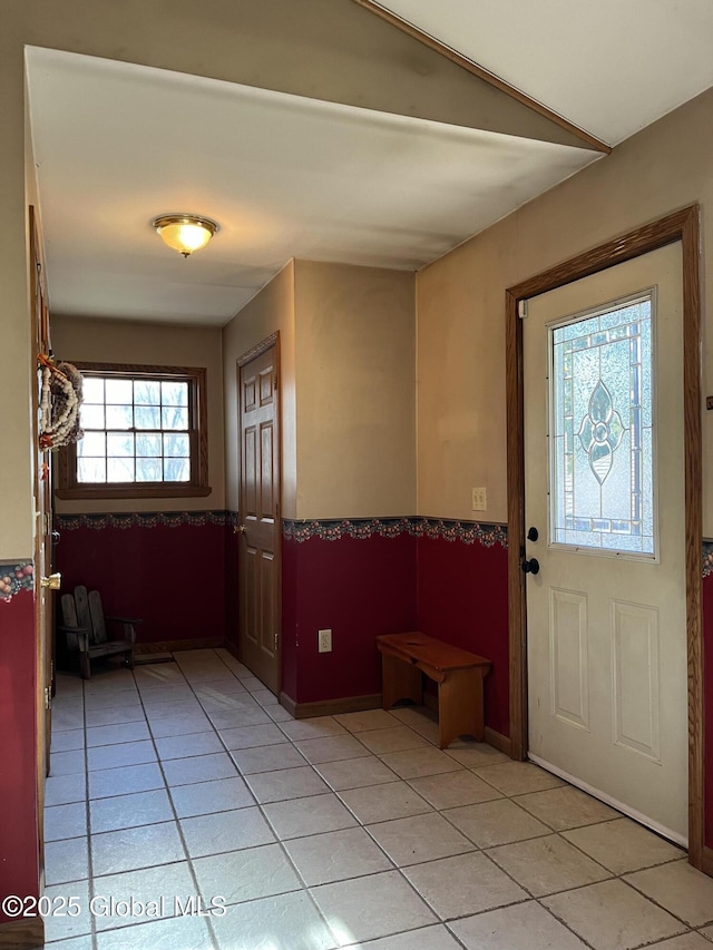 foyer entrance featuring light tile patterned floors