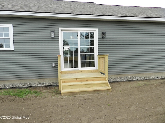 71 Bluebird Rd, Moreau, NY 12803 - view of exterior entry featuring a shingled roof