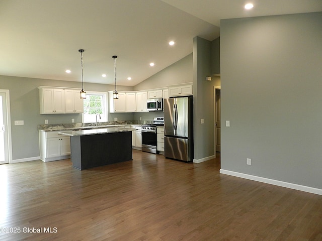 71 Bluebird Rd, Moreau, NY 12803 - kitchen with stainless steel appliances, a kitchen island, white cabinets, recessed lighting, and dark wood-style flooring