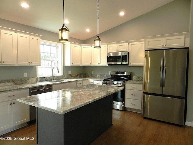 71 Bluebird Rd, Moreau, NY 12803 - kitchen featuring stainless steel appliances, lofted ceiling, white cabinetry, a kitchen island, and recessed lighting