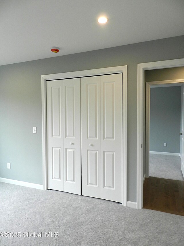 71 Bluebird Rd, Moreau, NY 12803 - unfurnished bedroom featuring carpet flooring, a closet, and recessed lighting
