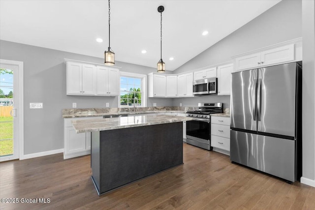 71 Bluebird Rd, Moreau, NY 12803 - kitchen with stainless steel appliances, white cabinetry, a center island, recessed lighting, and lofted ceiling