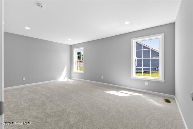 71 Bluebird Rd, Moreau, NY 12803 - spare room featuring carpet floors, recessed lighting, and a smoke detector