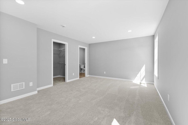 71 Bluebird Rd, Moreau, NY 12803 - unfurnished bedroom featuring carpet floors, a walk in closet, recessed lighting, and a closet