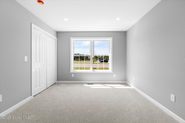 71 Bluebird Rd, Moreau, NY 12803 - unfurnished bedroom with carpet floors, a closet, and recessed lighting