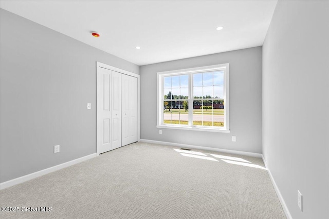 71 Bluebird Rd, Moreau, NY 12803 - unfurnished bedroom featuring carpet floors, a closet, and recessed lighting
