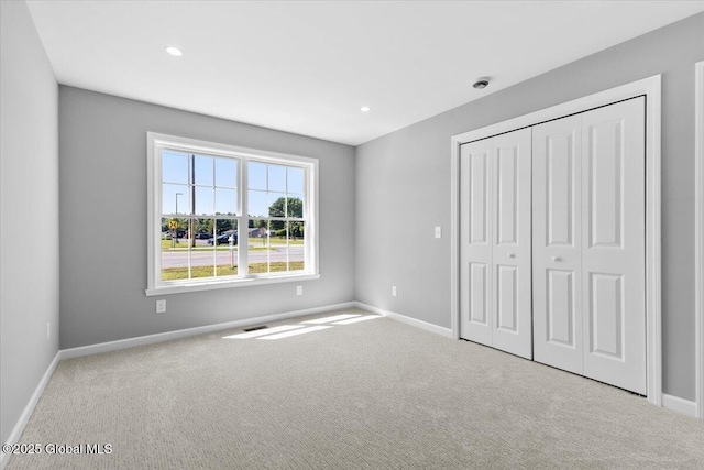 71 Bluebird Rd, Moreau, NY 12803 - unfurnished bedroom with carpet floors, a closet, and recessed lighting