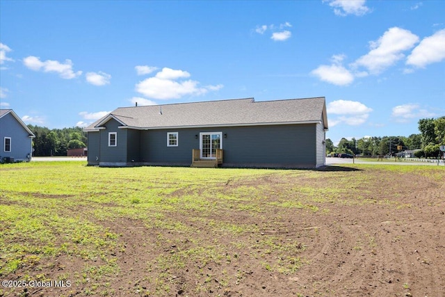 71 Bluebird Rd, Moreau, NY 12803 - back of property featuring a lawn and entry steps