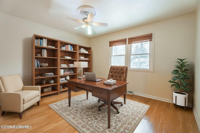 office area with ceiling fan and light hardwood / wood-style floors