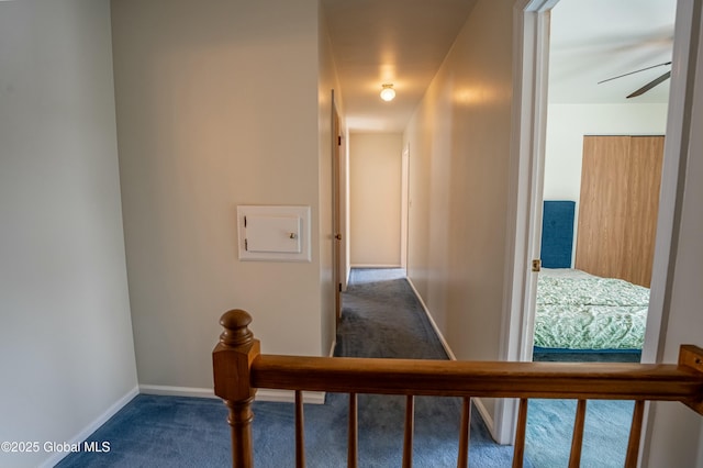 hallway with carpet flooring