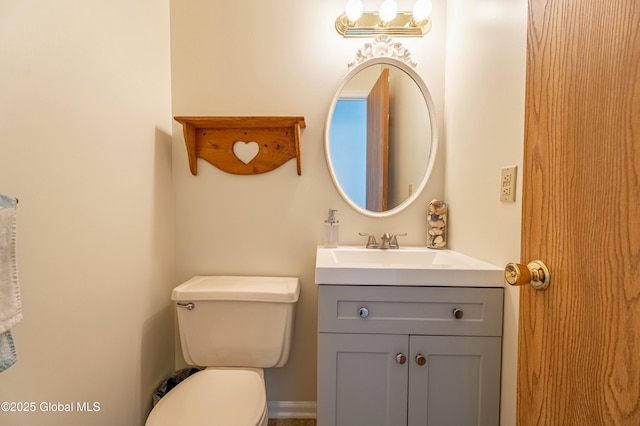 bathroom with toilet and vanity