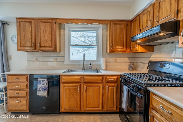 kitchen featuring black appliances, backsplash, and sink