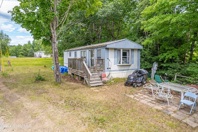 exterior space with a deck and a patio