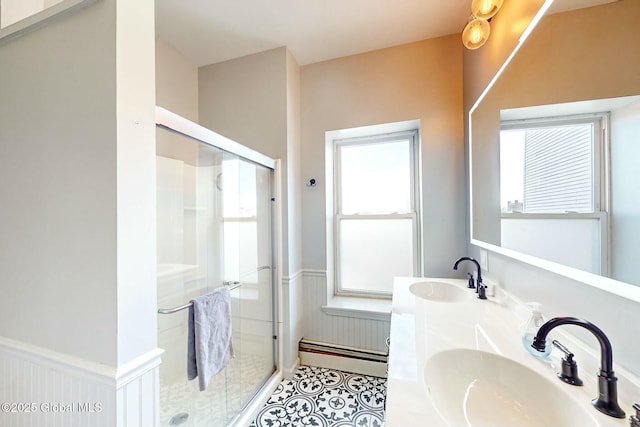 bathroom with walk in shower, a wealth of natural light, and baseboard heating