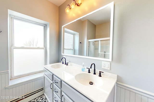 bathroom with a baseboard radiator and vanity