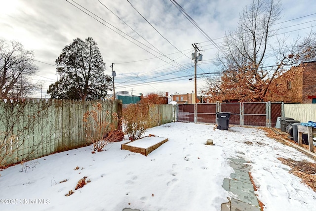 view of yard layered in snow