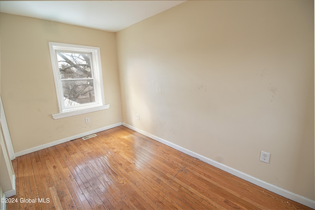 spare room with light wood-type flooring