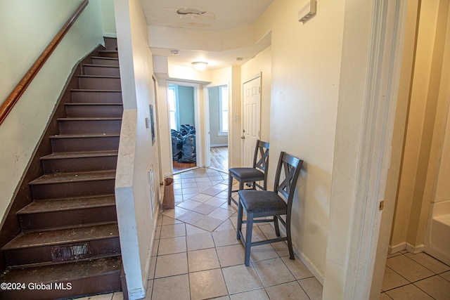 staircase with tile patterned flooring