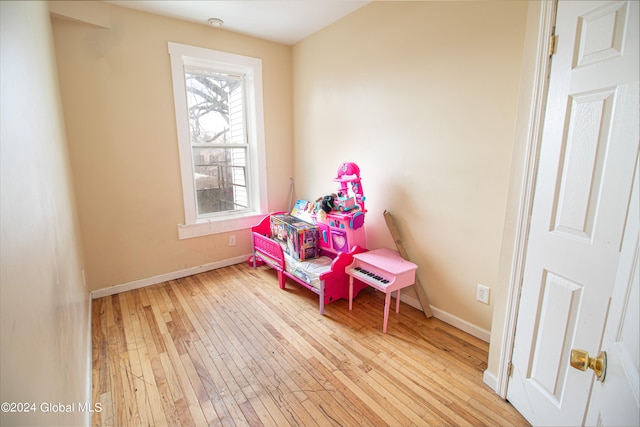 recreation room with light hardwood / wood-style flooring