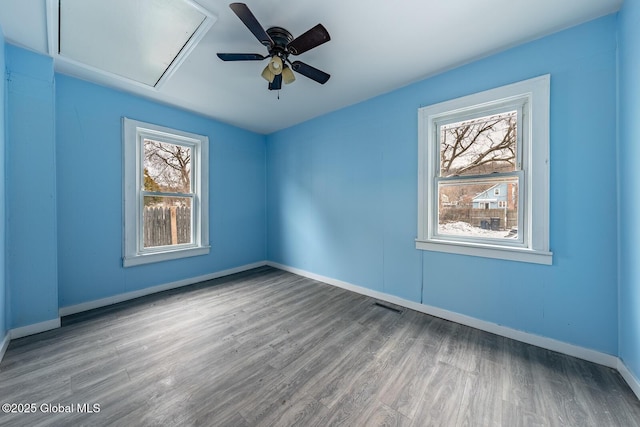 empty room featuring ceiling fan and light hardwood / wood-style floors