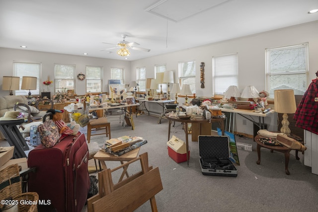 misc room featuring carpet and ceiling fan