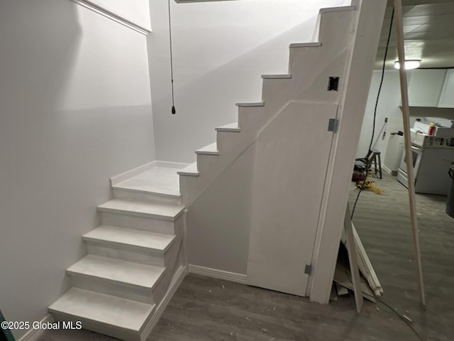 stairs with wood-type flooring