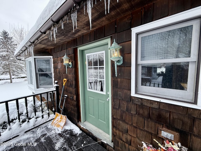 view of snow covered property entrance